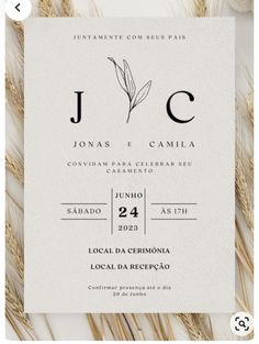 an image of a wedding card on top of some dried grass with the word, j c