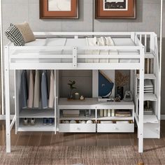 a white bunk bed with drawers underneath it and pictures on the wall behind it in a bedroom