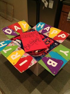 a birthday cake made to look like it is on top of a box with the words happy birthday written on it