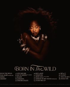 the album cover for born in the wild, featuring an image of a woman with her arms crossed