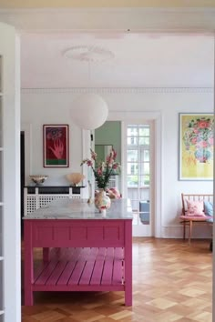 the kitchen island is painted bright pink