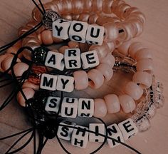 two bracelets with words that say you are my sunshine shine