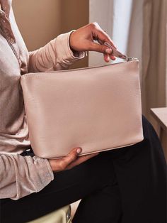 Handcrafted with love in Italy, this cosmetic bag is made from soft, premium quality dollaro leather that feels as luxurious as it looks. This sophisticated makeup pouch features a practical inside zip pocket, which makes it easy to separate your beauty and toiletry products when storing. The secure zipper closure ensures your makeup essentials stay in place, even on the go. Our toiletry bags come in two sizes to suit your specific beauty needs. Whether it's for your daily routine or a weekend g Minimalist Makeup Bag, Sophisticated Makeup, Leather Dopp Kit, Minimalist Makeup, Leather Cosmetic Bag, Leather Makeup Bag, Leather Toiletry Bag, Toiletries Organization, Dopp Kit