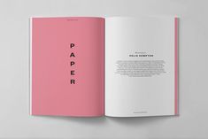 an open pink book with the title paper printed on it's front and back pages