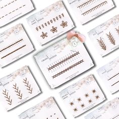 a bunch of different types of nail art designs on white paper with pink flowers and leaves