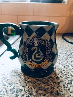 a harry potter mug sitting on top of a counter