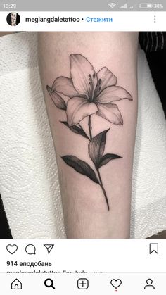 a black and white flower tattoo on the leg