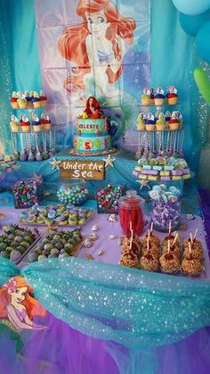 the little mermaid birthday party is complete with cupcakes, cookies and candy bars