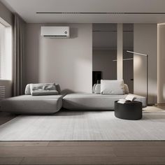 a modern living room with white and gray furniture