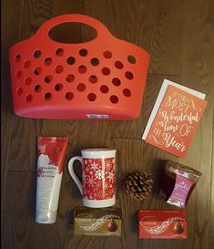 the contents of a hot chocolate bar laid out on top of a wooden table next to a mug