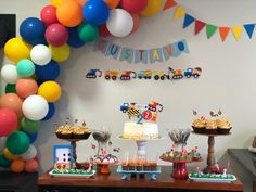 a birthday party with colorful balloons and desserts