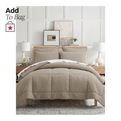 an image of a bed with beige comforter and pillows