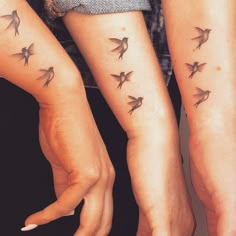 two women with matching tattoos on their arms