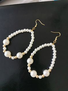 Pearl earrings are truly the symbol of elegance and timeless chic. They bring a touch of refinement to any outfit and illuminate the face of those who wear them. Their delicate appearance and natural shine testify to their preciousness and beauty. They are also the ideal gift to celebrate significant events such as a birthday, a graduation or a wedding. Timeless, pearl earrings are an undeniable asset of seduction. They bring a note of subtle elegance that leaves no one indifferent. Whether you Pearl White Pear-shaped Party Jewelry, Elegant Hoop Clip-on Earrings For Formal Occasions, Elegant Hoop Clip-on Earrings For Formal Events, Elegant Formal Clip-on Hoop Earrings, Classic White Pearl Earrings For Party, White Elegant Teardrop Earrings, White Pierced Bridal Earrings For Party, Elegant Oval Chandelier Earrings For Weddings, White Pear-shaped Party Jewelry