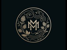 the letter m is made up of flowers and leaves in a circle with swirls