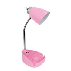 a pink desk lamp sitting on top of a white wall