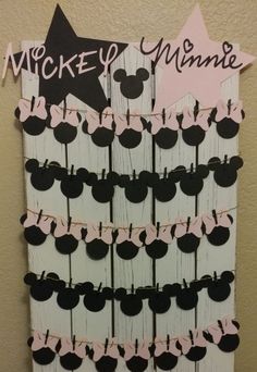 a mickey mouse themed bulletin board with black and pink decorations