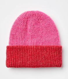 a pink and red beanie on a white background