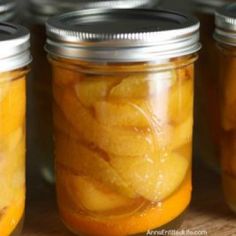 canned drukken vanilla bourbon peaches recipe in mason jars with text overlay