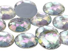 many different colored diamonds on a white surface