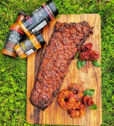 the steak is ready to be cooked on the cutting board with some spices and seasonings