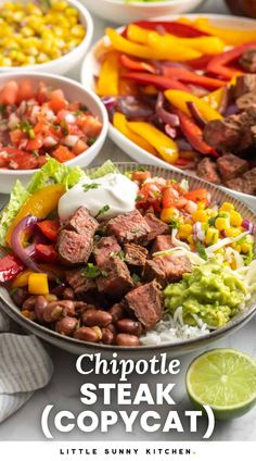 a plate filled with steak and vegetables next to bowls of beans, peppers, corn