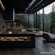 a modern kitchen with an island counter and seating area in front of large windows overlooking the mountains