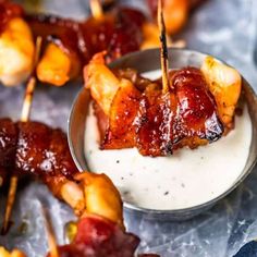 bacon skewers with ranch dressing in a bowl