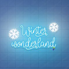 the words winter wonderland written in white on a blue tiled wall