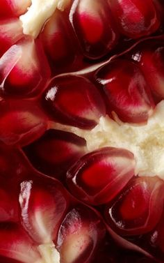 a close up view of a pomegranate that has been cut in half