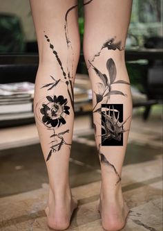 a woman's legs with flowers and leaves on them