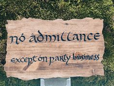 a wooden sign that says no admittance except on party business written in black ink