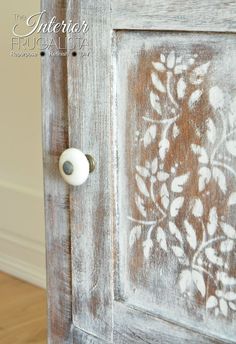 an old door has been painted with white paint