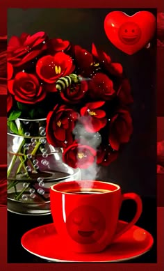 a red coffee cup with steam rising out of it next to a vase filled with roses