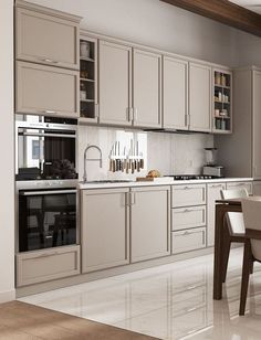 a kitchen with white walls and wooden floors