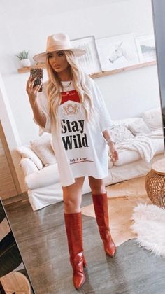 Stay Wild T-Shirt Dress is concert, rodeo, and nash bash approved! Our Stay Wild T-Shirt Dress is comfortable and fitted, so you can rock out at Stagecoach Festival, Coachella, Bonnaroo, Lollapalooza or anywhere else. Plus, everyone deserves a festival T-Shirt Dress fit. You'll get compliments everywhere you go with this Rebel Gypsy vibe! To make sure you have the right fit – we want everyone feeling good when they wear this outfit - check our size chart. Hoedown Outfit Parties, Country Tshirt Dress Outfit, All American Rejects Concert Outfit, Post Malone Concert Outfit Women, Jellyroll Concert Outfit Ideas, Gig Outfit Ideas Indie, Fun Going Out Outfits, Classy Party Outfits For Women, Bourbon And Beyond Festival Outfits