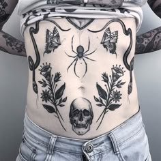 a woman with tattoos on her stomach and back