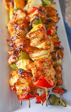 several skewers filled with meat and vegetables