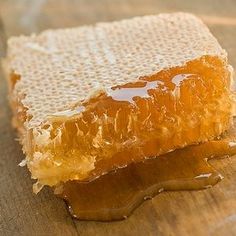 a piece of honey sitting on top of a wooden table