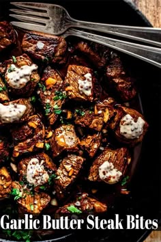 a black pan filled with garlic butter steak bites