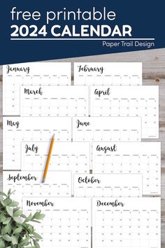 the free printable calendar is shown on top of a wooden table with greenery