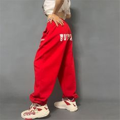 Made from top-quality polyester and cotton materials, these loose sweatpants for women complement your carefree personality perfectly. Featuring a straight fit that is further enhanced by their flat front design, these hip-hop bottoms come with an elastic waist that ensures you stay comfortable for hours. Adorned with pockets that not only look great but are super convenient too, this trendy streetwear is a must-add to your collection!Specifications Waist Type: MID Style: Casual Season: Spring/A Baggy High-waist Pants With Letter Print, Baggy High Waist Pants With Letter Print, Baggy Cotton Pants For Sports, Hip Hop Style Cotton Sports Pants, Red Sporty Pants For Leisure, Red Sporty Leisure Pants, Casual Baggy Pants With Letter Print, Red Baggy Sporty Bottoms, Hip Hop Style Sports Cotton Bottoms