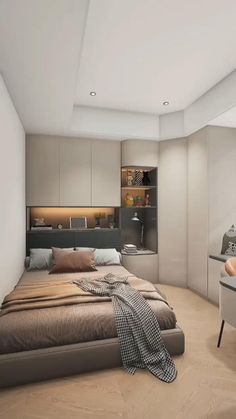 a bedroom with a bed, desk and chair in it