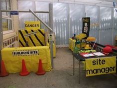 construction signs and barricades are set up in front of the building site manager