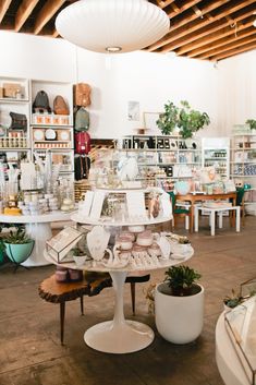 a room filled with lots of different types of furniture and decor on display in it