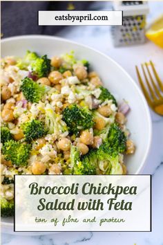 broccoli chickpea salad with feta in a white bowl on a marble table