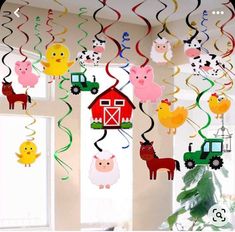 farm animals and farm animals hanging from the ceiling with streamers in front of them