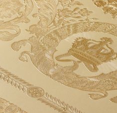 an intricately designed wallpaper with gold and white designs on the surface, including a coat of arms