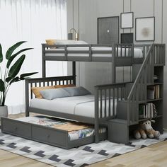 there is a bunk bed with stairs in the corner and a storage drawer underneath it