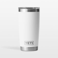 a white yeti cup with the word yeti on it's front and side